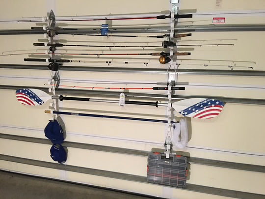 two hooks racks installed on a garage door